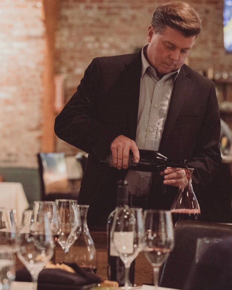 Advanced Sommelier John Hansen decanting wine